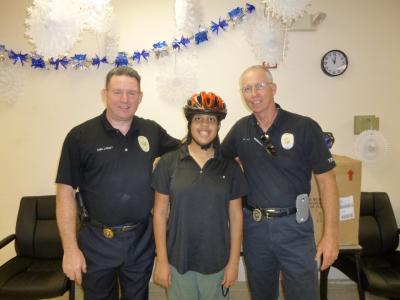 Bicycle Safety Program participant with officers